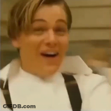Bald Man In Suit And Tie Making Funny Face On Stage GIF