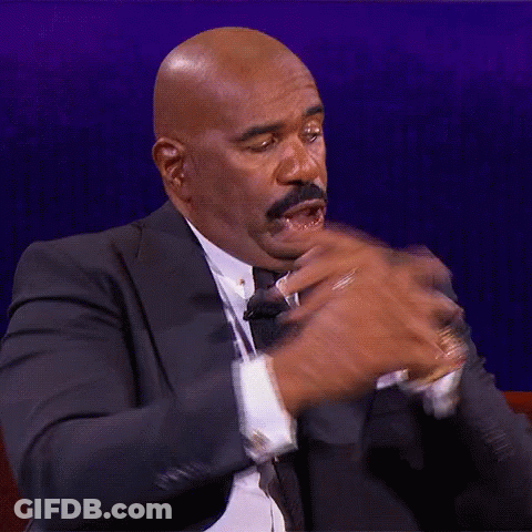 Bald Man In Suit And Tie Making Funny Face GIF