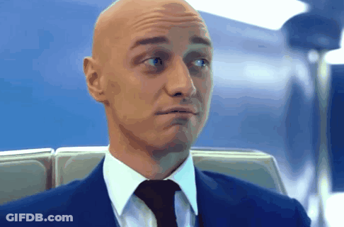 Bald Man In Suit And Tie Making Funny Face GIF
