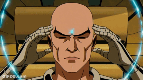 Bald Man In Suit And Tie Sitting In Chair GIF