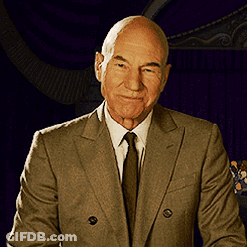Bald Man In Suit And Tie Smiling GIF