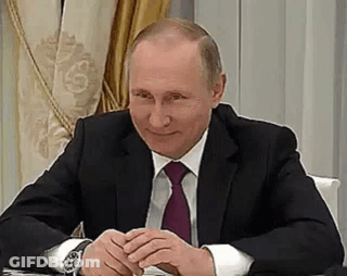 Bald Man In Suit And Tie With Folded Hands GIF