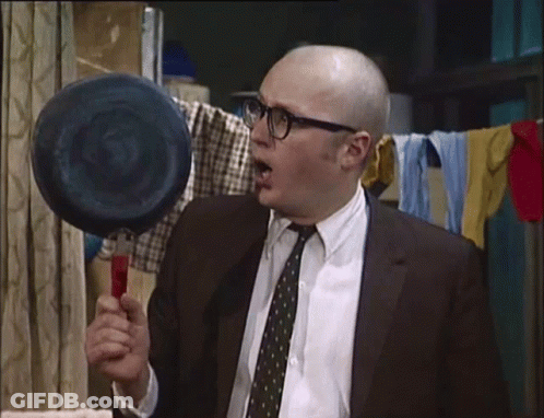 Bald Man In Suit Holding Sponge GIF