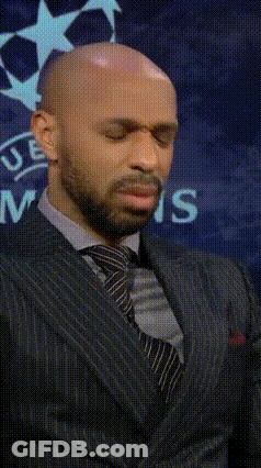 Bald Man In Suit In Front Of UEFA Logo GIF
