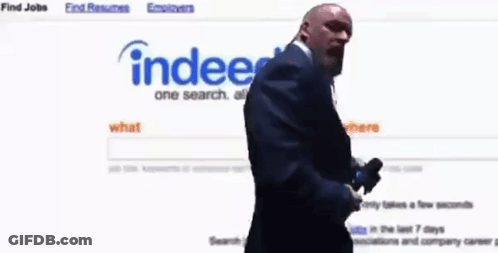 Bald Man In Suit Looking At Website Index GIF