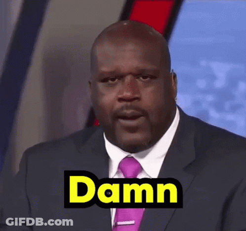 Bald Man In Suit Making Funny Face Saying Damn GIF