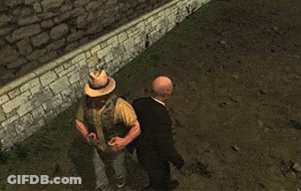 Bald Man In Suit Next To Man In Hat GIF