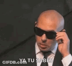 Bald Man In Suit Talking On Cell Phone GIF