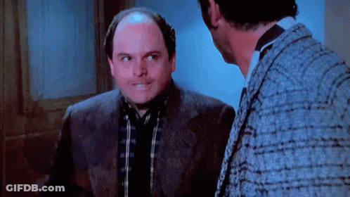 Bald Man In Suit Talking To Another Man GIF