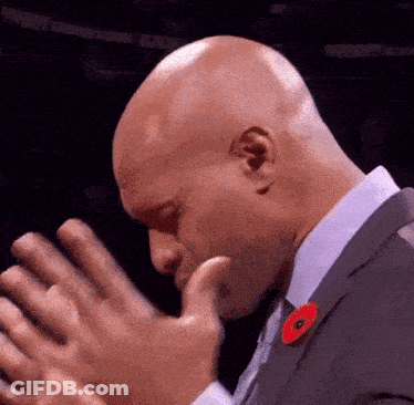 Bald Man In Suit With Red Poppy GIF