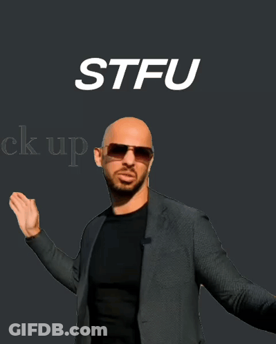 Bald Man In Sunglasses And Suit In Front Of STFU Sign GIF