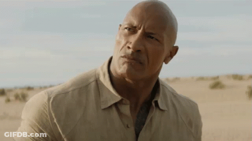 Bald Man In Tan Shirt Desert Mouth Open GIF