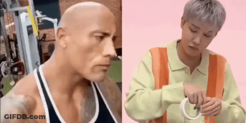 Bald Man In Tank Top Next To Man In Orange Vest GIF