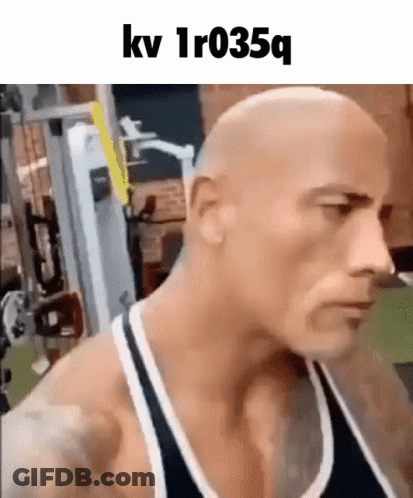Bald Man In Tank Top Standing In Gym GIF