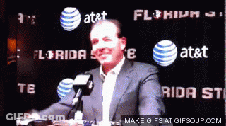 Bald Man In White Shirt And Tie Holding Hose Smiling GIF