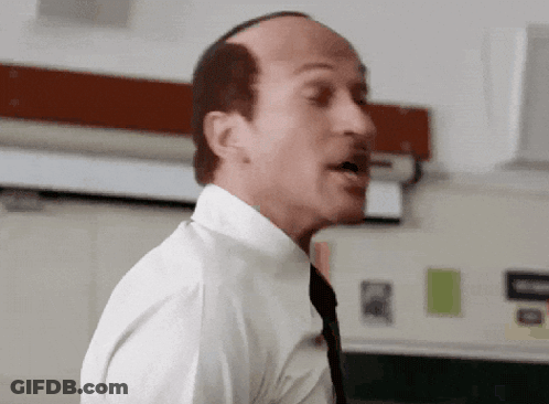 Bald Man In White Shirt And Tie Speaking GIF