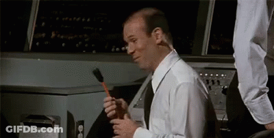 Bald Man In White Shirt Holding Brush GIF