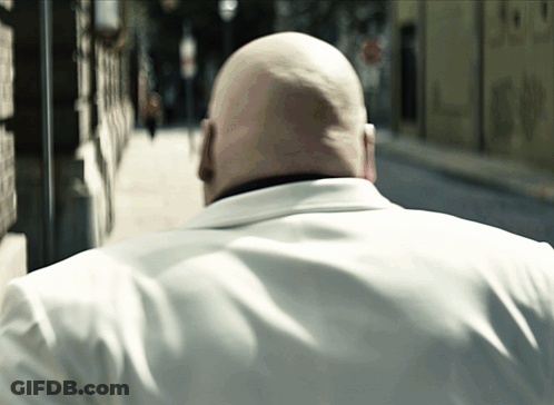 Bald Man In White Shirt Walking GIF