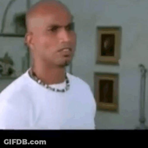 Bald Man In White Shirt With Necklace GIF