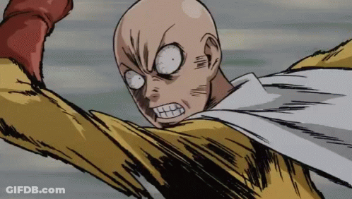 Bald Man In Yellow And White Superhero Costume Making Funny Face GIF