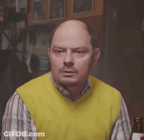 Bald Man In Yellow Vest And Plaid Shirt With Beer GIF