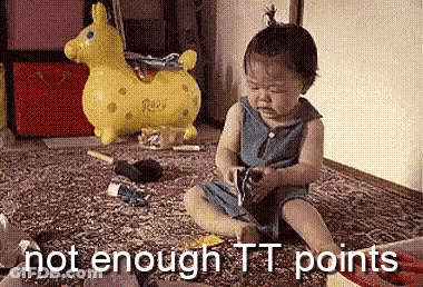 Bald Man Kneeling In Front Of Table With Sticker Saying A Few GIF