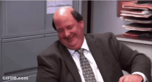 Bald Man Laughing In Suit And Tie GIF