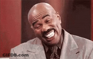 Bald Man Laughing With Mustache In Suit GIF