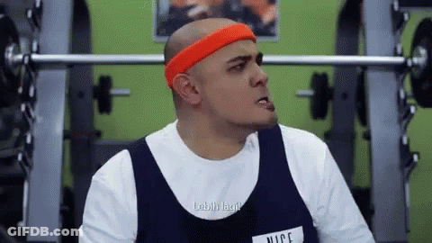 Bald Man Lifting Weights In Gym GIF