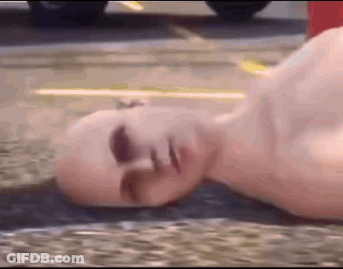 Bald Man Lying On Ground GIF