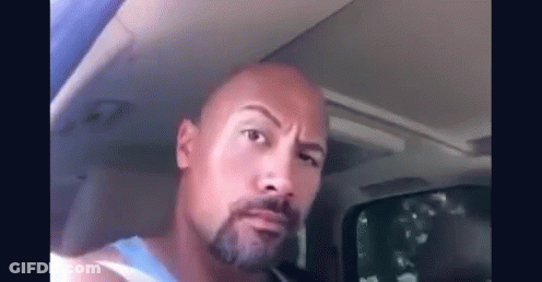 Bald Man Making Funny Face In Car GIF
