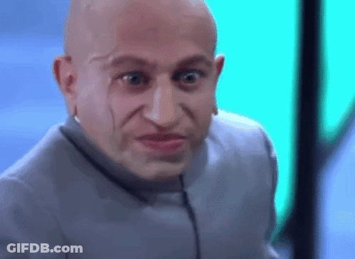 Bald Man Making Funny Face In Gray Suit GIF
