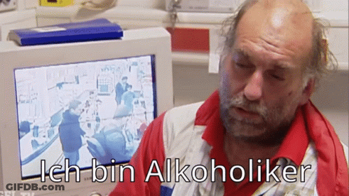Bald Man Sitting At Computer Saying Ich Bin Alkoholiker GIF