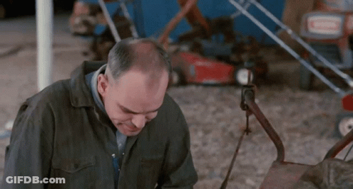 Bald Man Sitting At Diner Table GIF