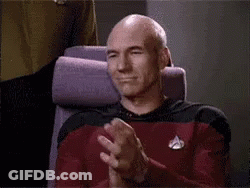 Bald Man Sitting In Chair Applauding GIF