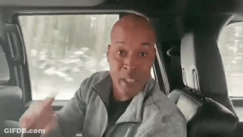 Bald Man Sitting In Driver's Seat GIF
