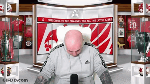 Bald Man Sitting In Front Of Subscribe Sign GIF