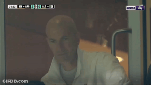 Bald Man Sitting In Front Of TV Saying Live GIF