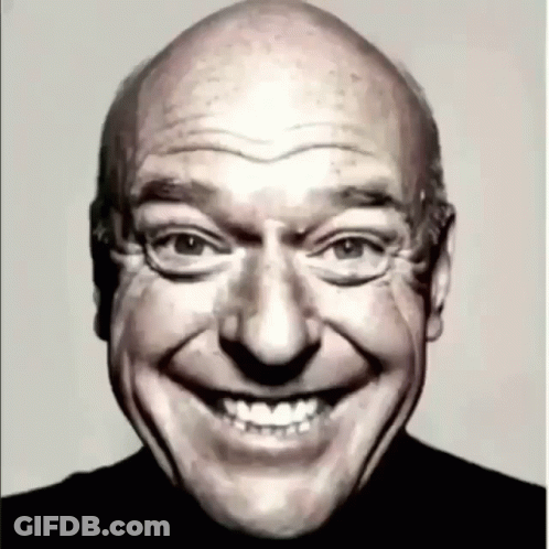 Bald Man Smiling In Black Shirt GIF