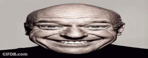Bald Man Smiling In Black Shirt GIF