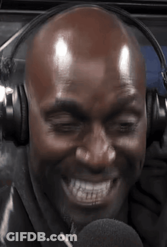 Bald Man Smiling In Headphones And Microphone GIF