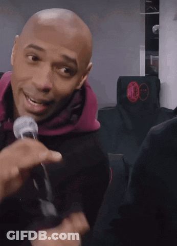 Bald Man Smiling With Microphone GIF