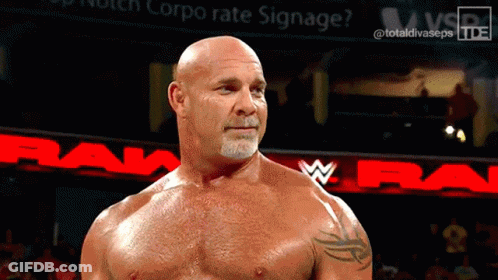 Bald Man Standing In Front Of Raw Sign GIF