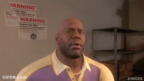 Bald Man Standing In Front Of Warning Sign GIF