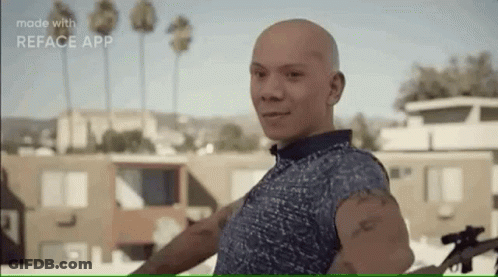 Bald Man Standing With Sniper Rifle GIF