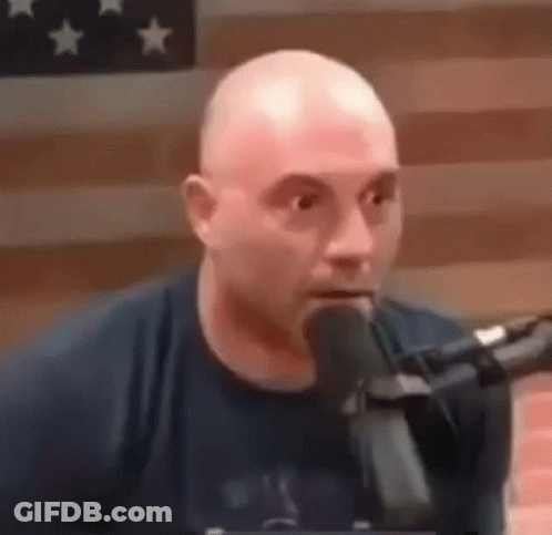 Bald Man Talking Into Microphone GIF