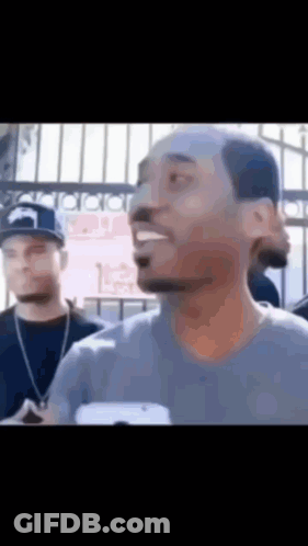 Bald Man Talking To Group GIF