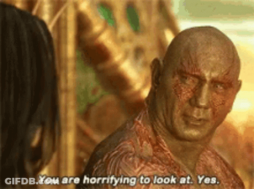 Bald Man Talking To Woman In Movie GIF