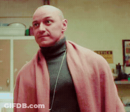Bald Man Turtleneck Pink Scarf Looks At Camera GIF