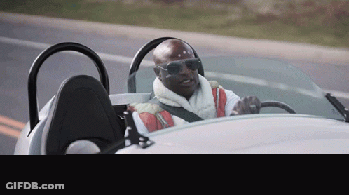 Bald Man Wearing Sunglasses Driving White Sports Car GIF